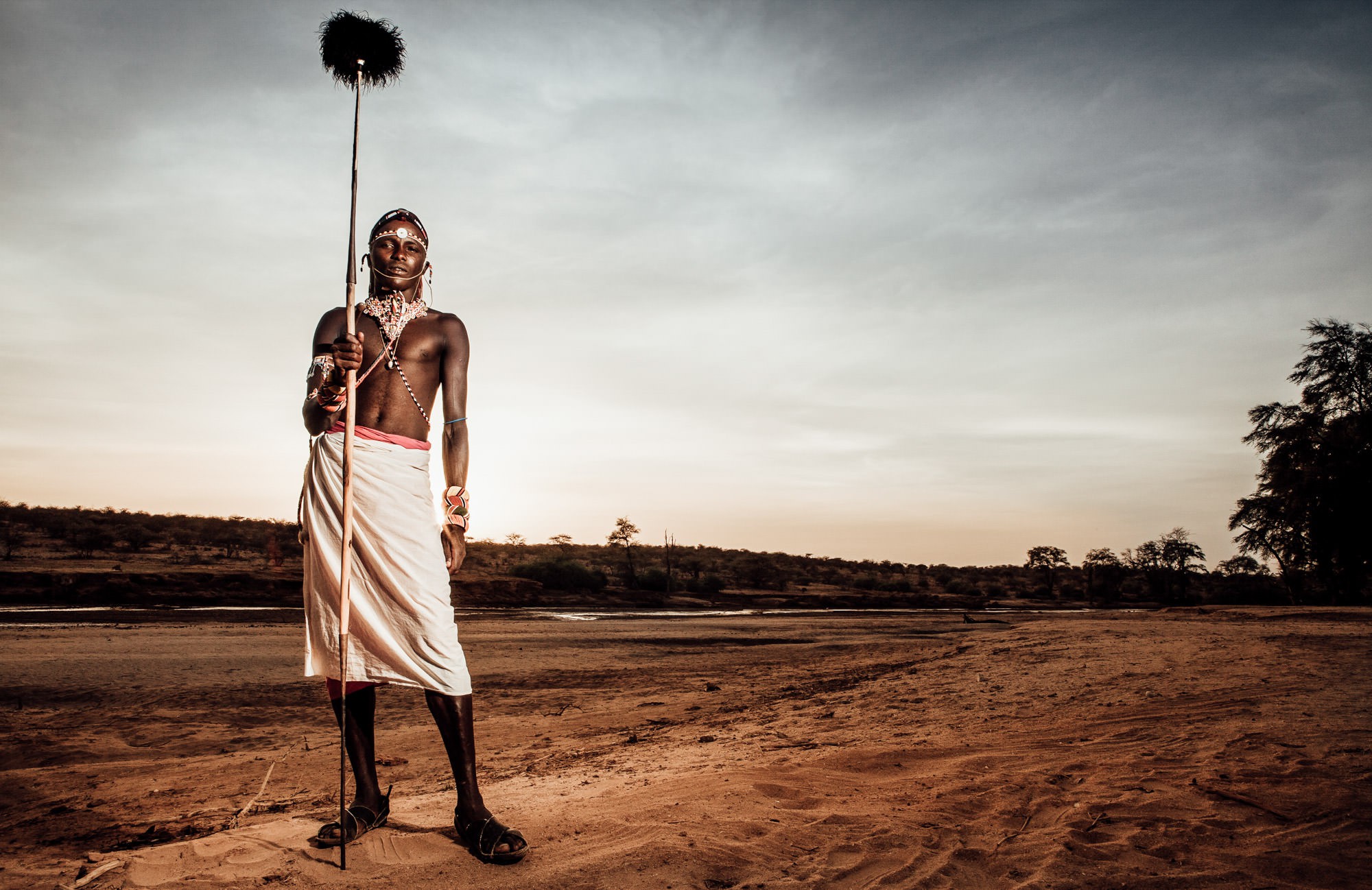 Samburu warrior with spear by the riverbed, Kenya, Africa