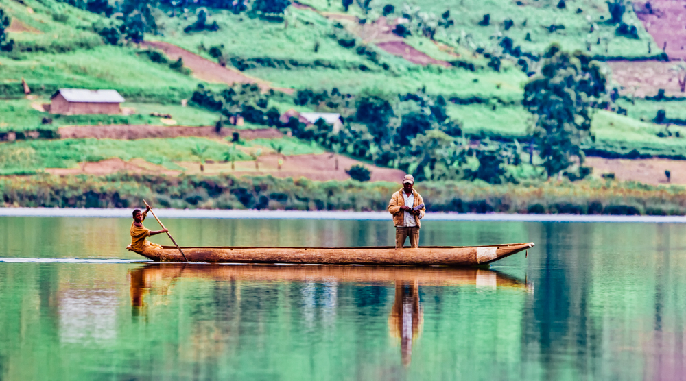 Rwanda locals in canoe, Africa.